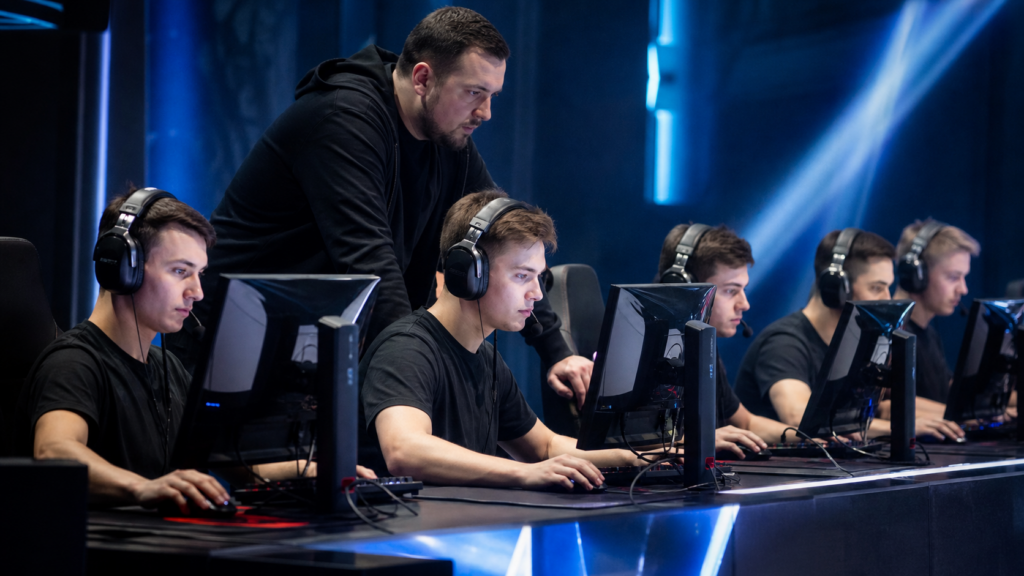 Counter-Strike coach guiding a team at a regional LAN