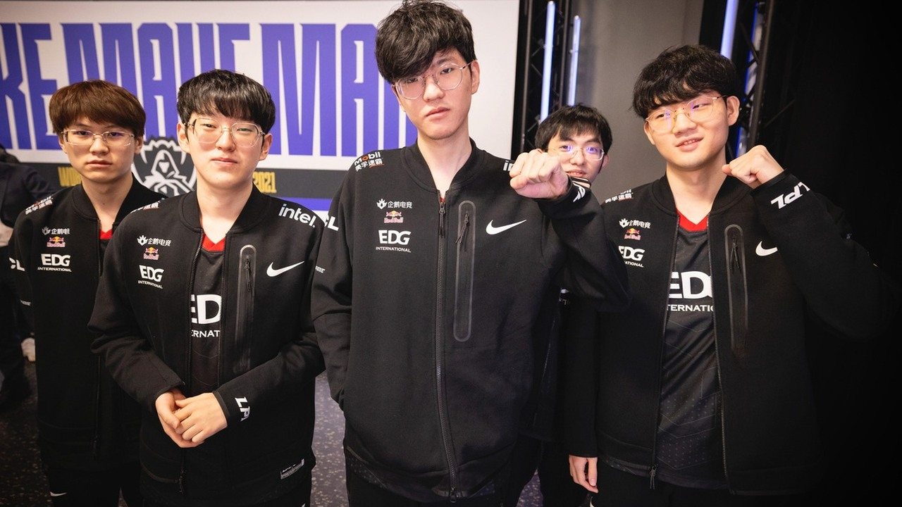 Edward Gaming players stand together in black team jackets