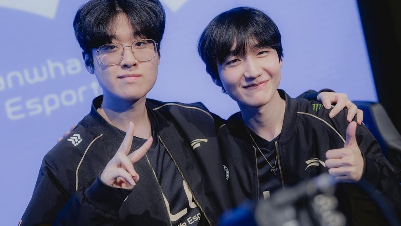 Two Hanwha Life Esports players stand on stage