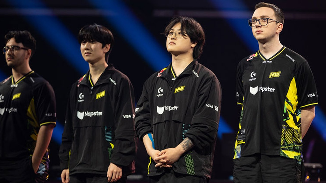 Four Natus Vincere League of Legends players stand on stage