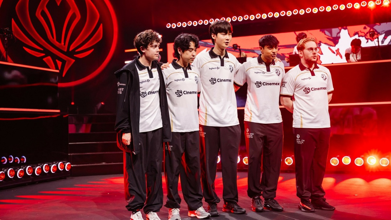 FlyQuest players stand together on a tournament stage