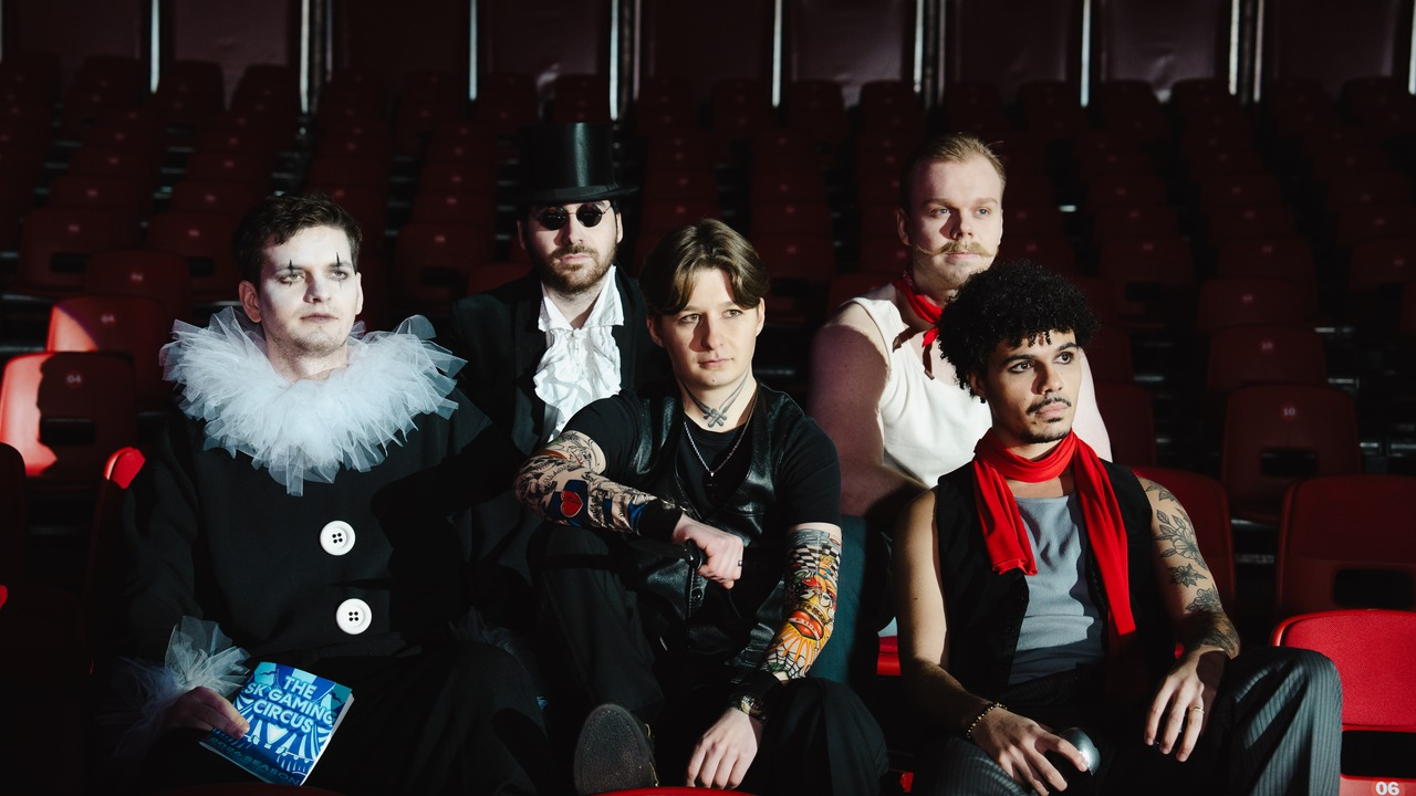Five SK Gaming League of Legends players sit together in a theatre