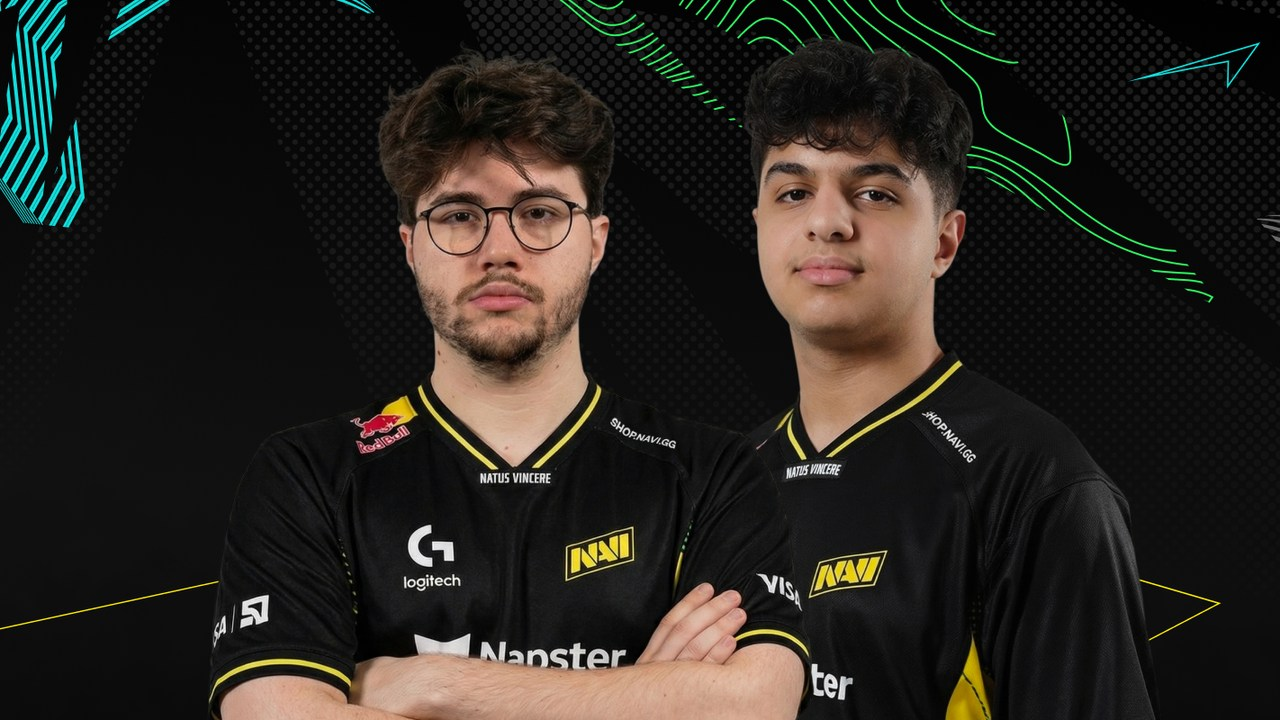 Two NAVI Valorant players pose in black and yellow team jerseys