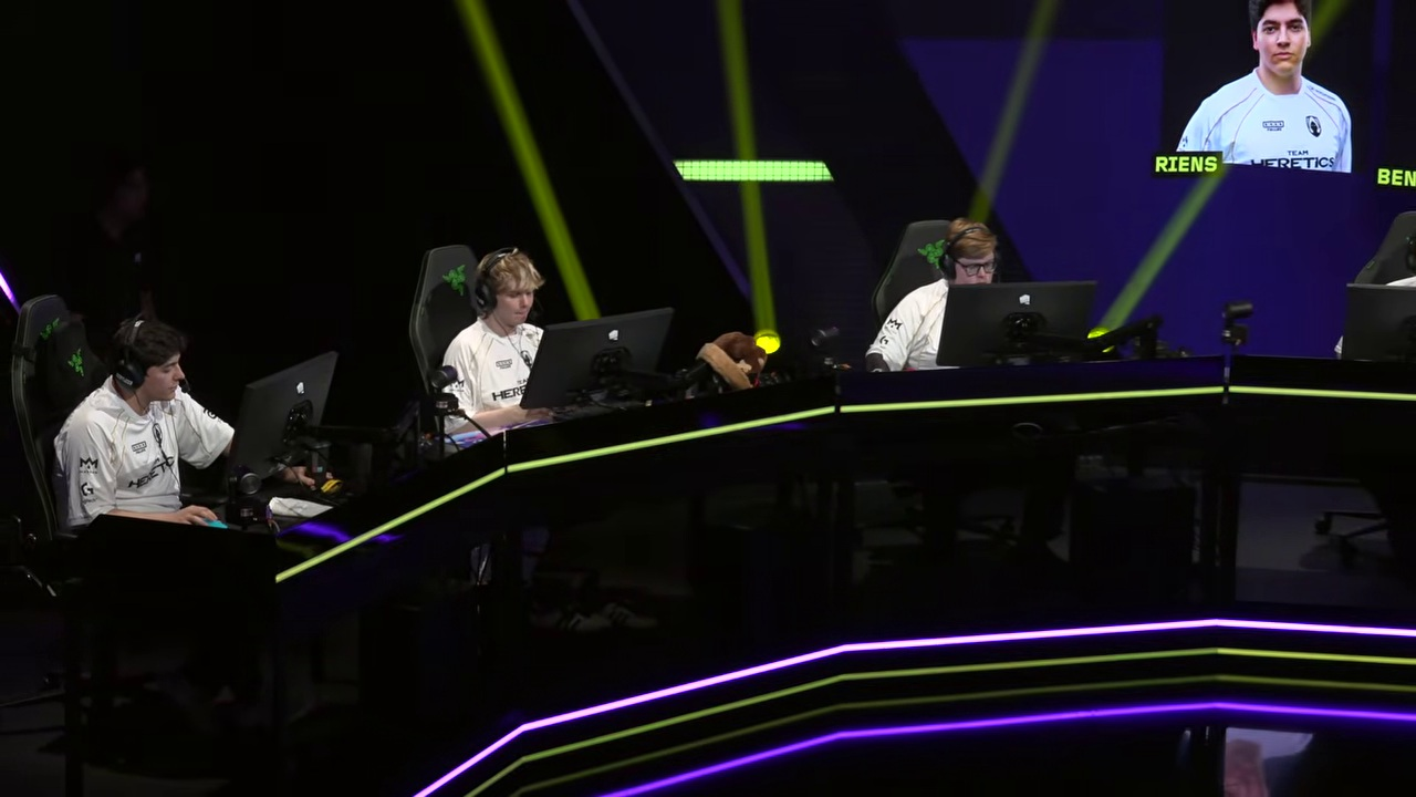 Team Heretics players sit together at their computers on the VCT EMEA stage