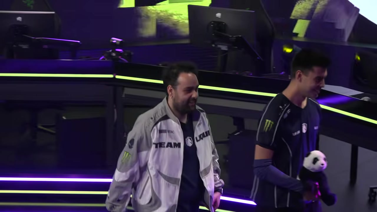 Team Liquid and Team Heretics players cross on stage