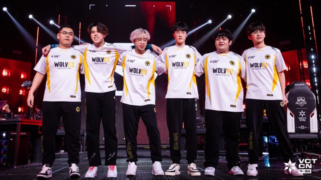 Wolves Esports Valorant players stand together on stage