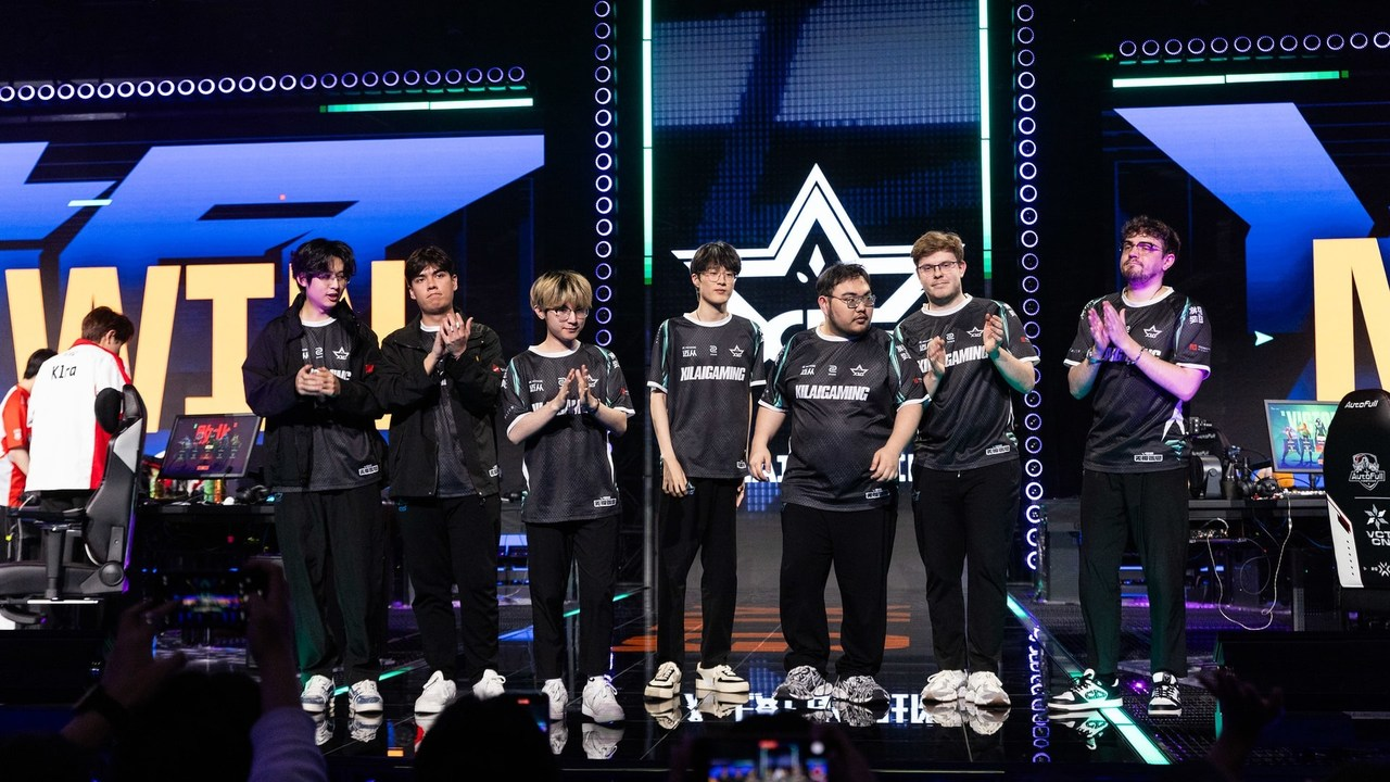 Xi Lai Gaming Valorant players applaud together on a tournament stage