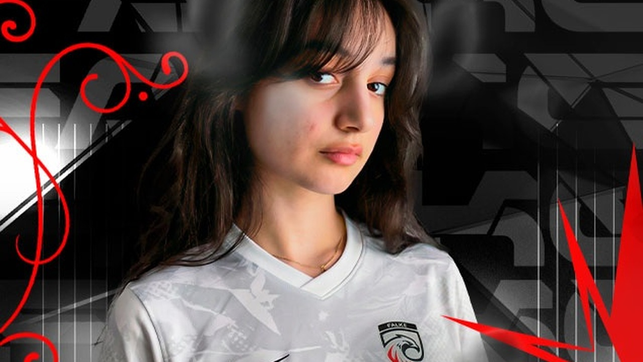 A FALKE VENOM Valorant player poses in a white team jersey