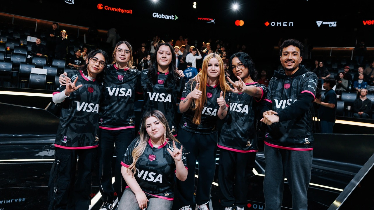 KRU Blaze players pose together inside an esports arena