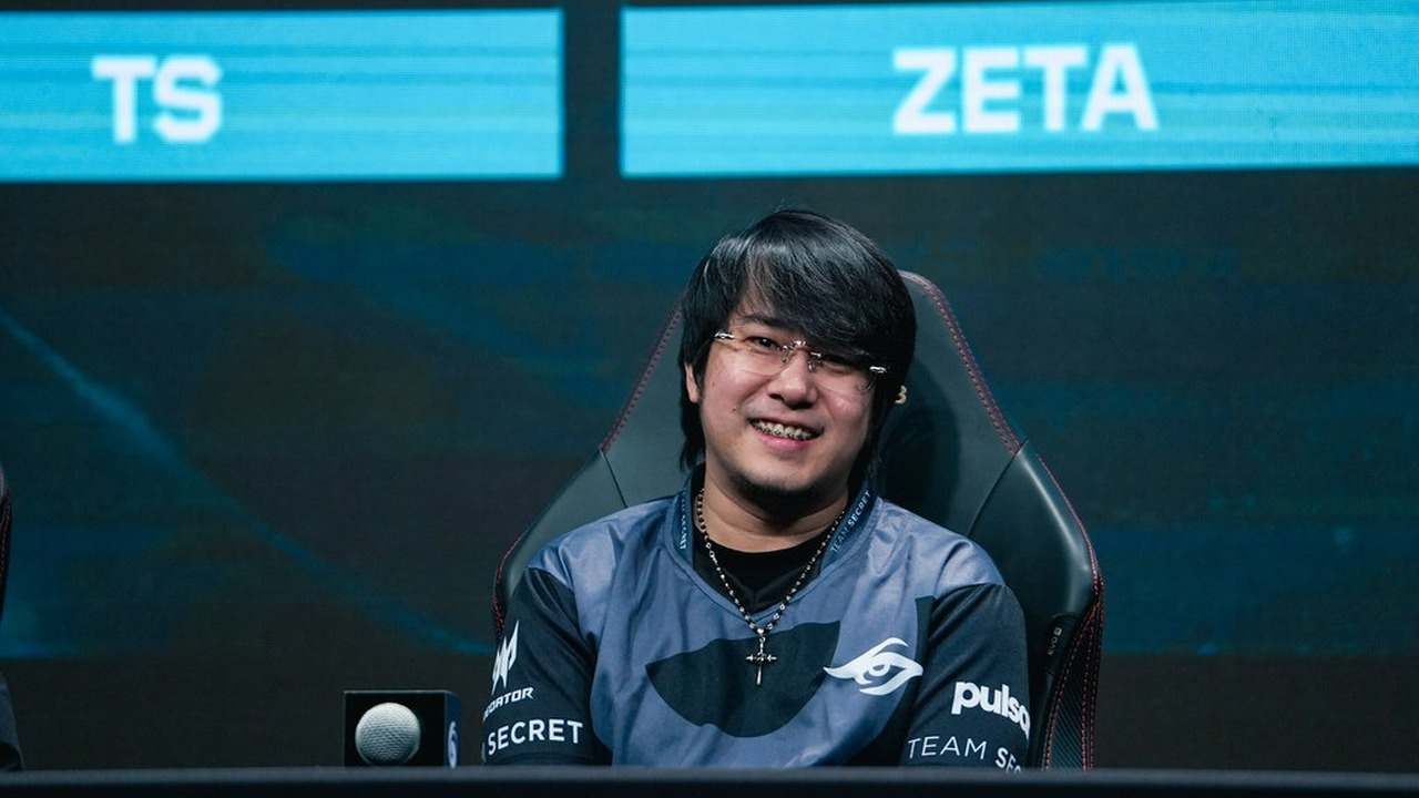 A Team Secret Valorant player sits at the tournament desk