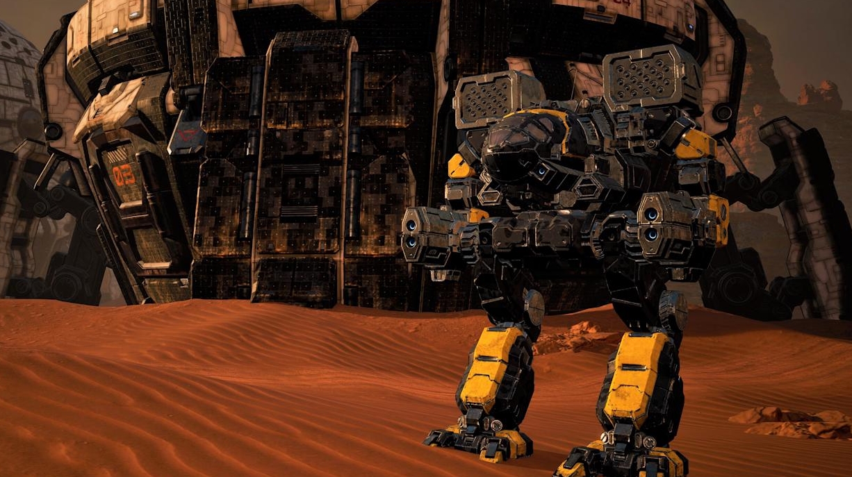 Heavy battle mech standing in desert base in MechWarrior 5 Clans
