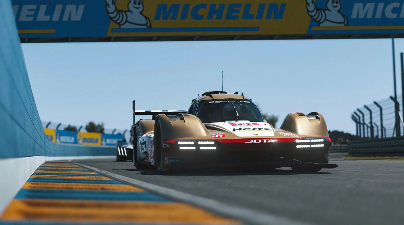 Porsche hypercar racing on track under Michelin banner in Le Mans Ultimate