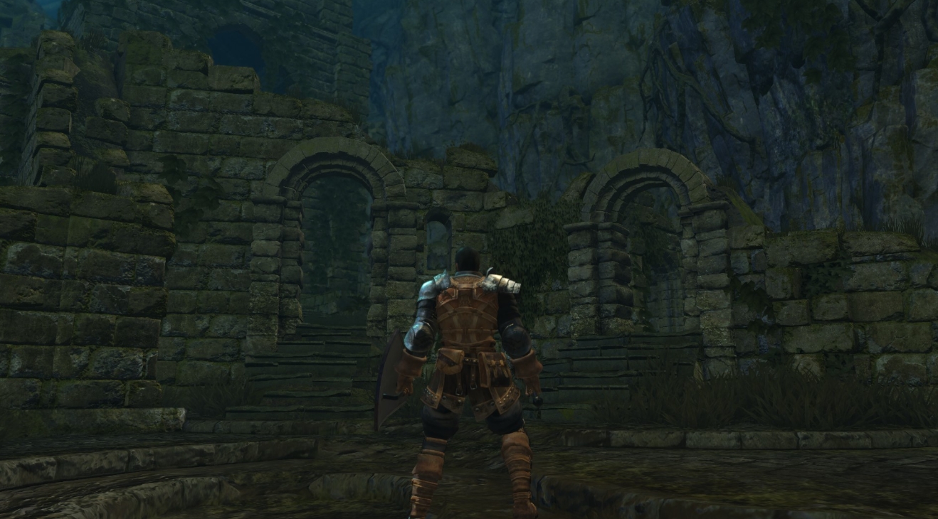 Armored character exploring ancient stone ruins in a forest area in Dark Souls Remastered