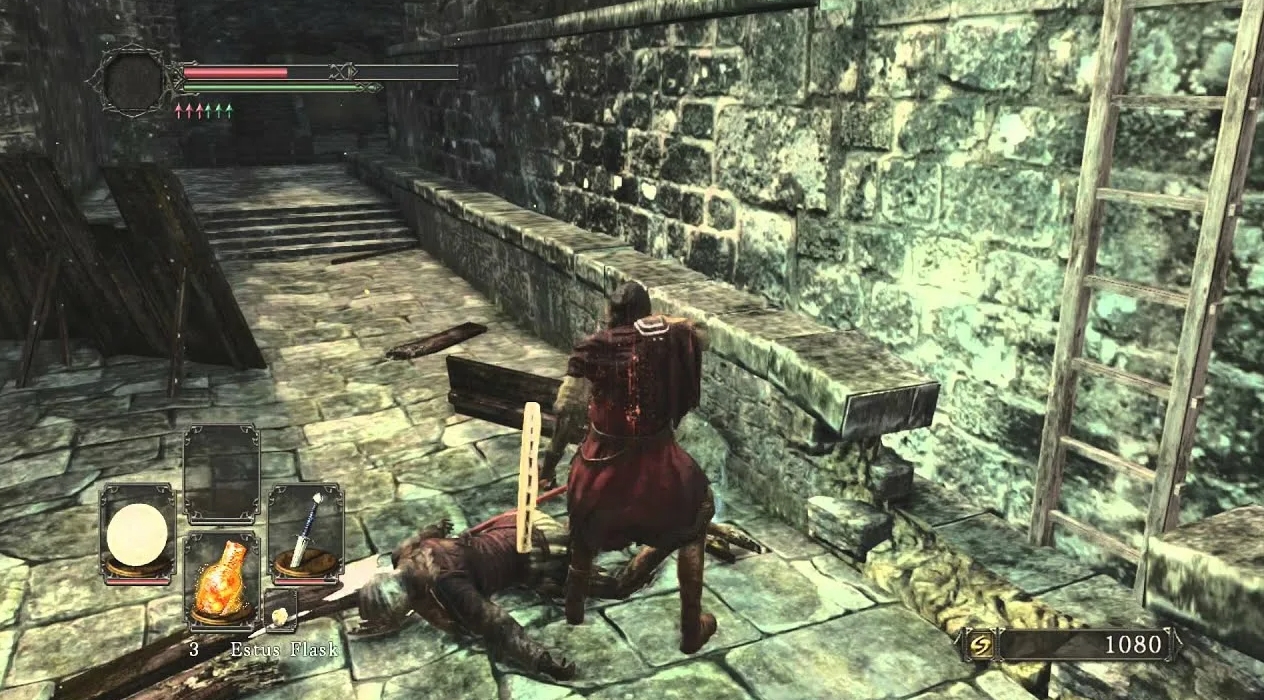 Dark Souls 2 combat scene with player looting enemy near stone wall