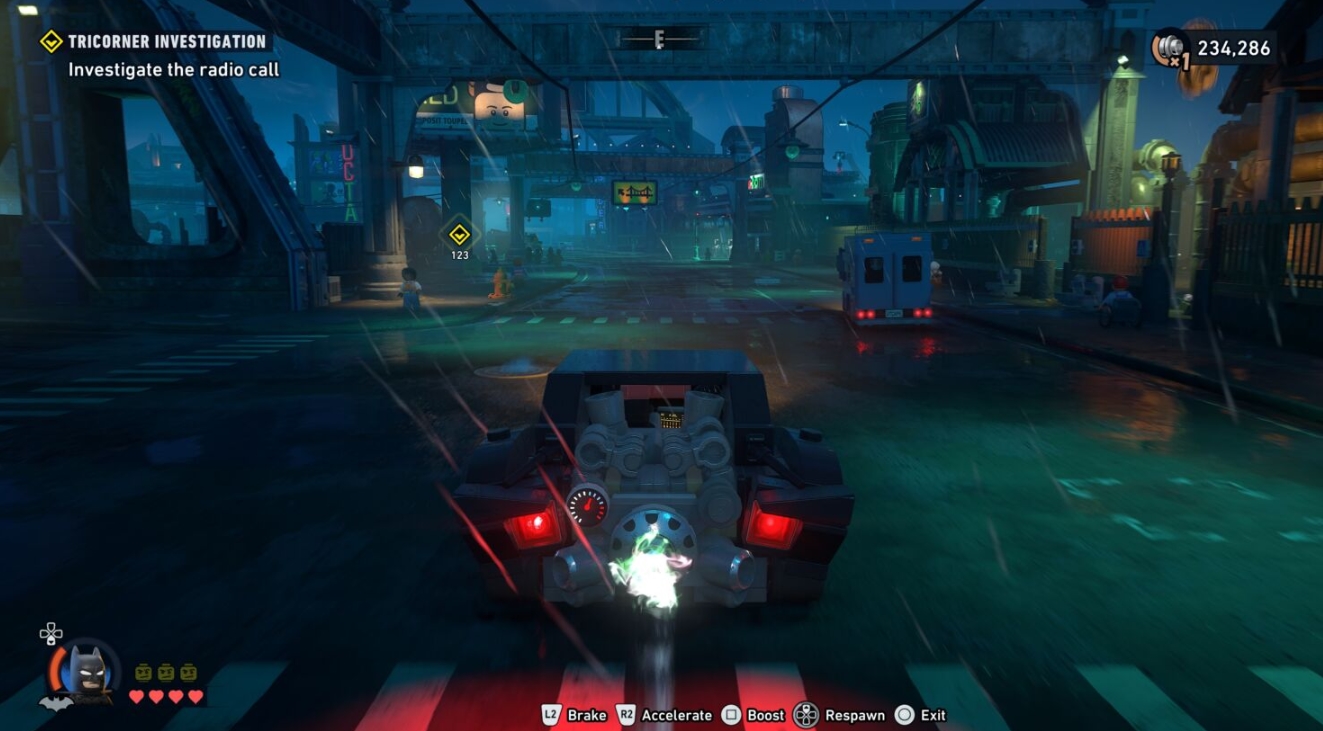 Batmobile chase through nighttime Gotham in LEGO Batman Legacy of the Dark Knight