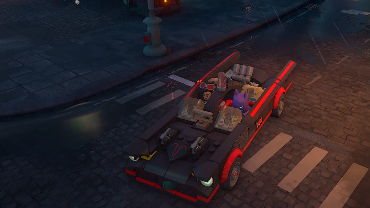 LEGO Batman Batmobile driving through wet Gotham streets at night