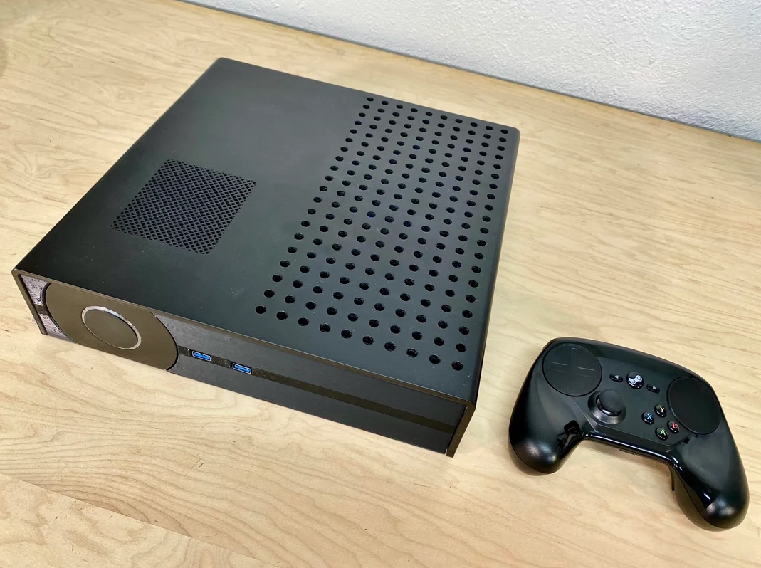 Compact Steam Machine chassis with ventilation holes and front USB ports
