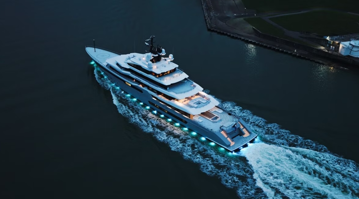The luxury superyacht Leviathan cruising through the water at dusk