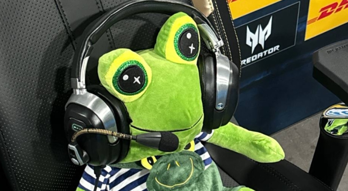 Zhab Zhabych plush frog wearing a gaming headset sits in Team Spirit's coach position at the IEM Cologne Major 2026