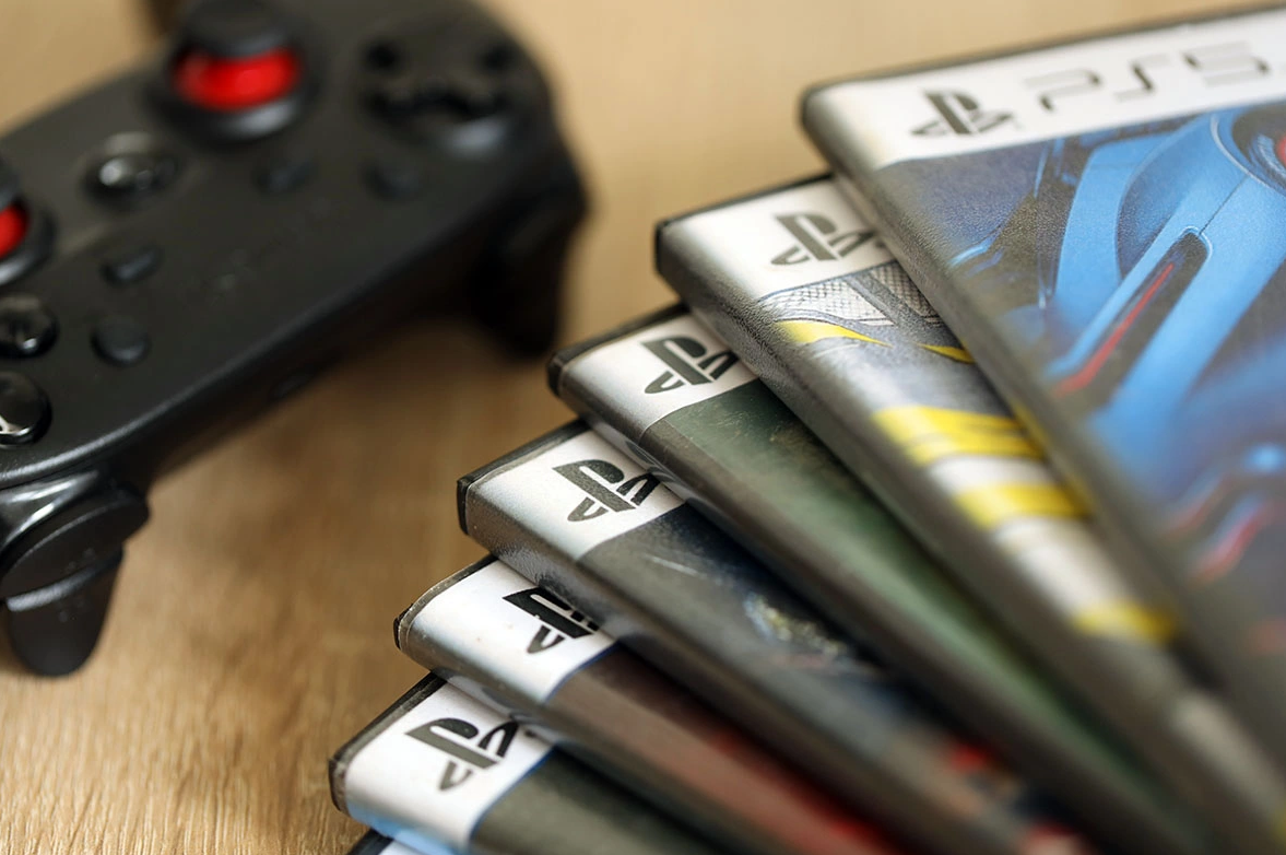 PlayStation game cases as publishers criticize Sony's decision to abandon physical discs and transition to digital-only game releases after 2028