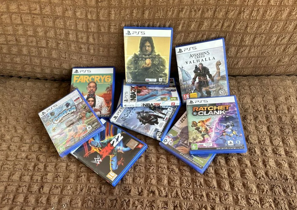 PS5 physical game collection showing boxed PlayStation 5 releases