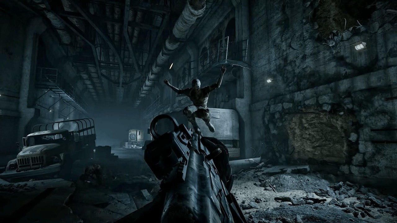 STALKER 2 characters gather inside a dark industrial location